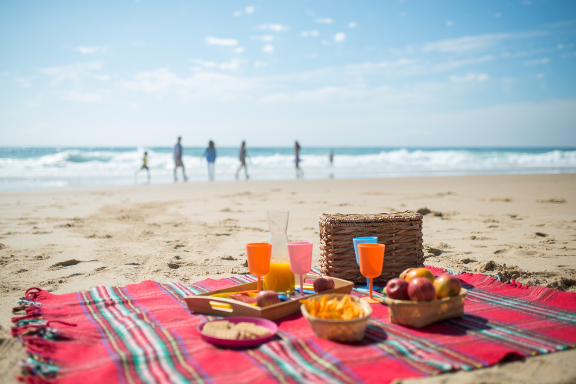 Food in a Picnic Blanket in the Beach